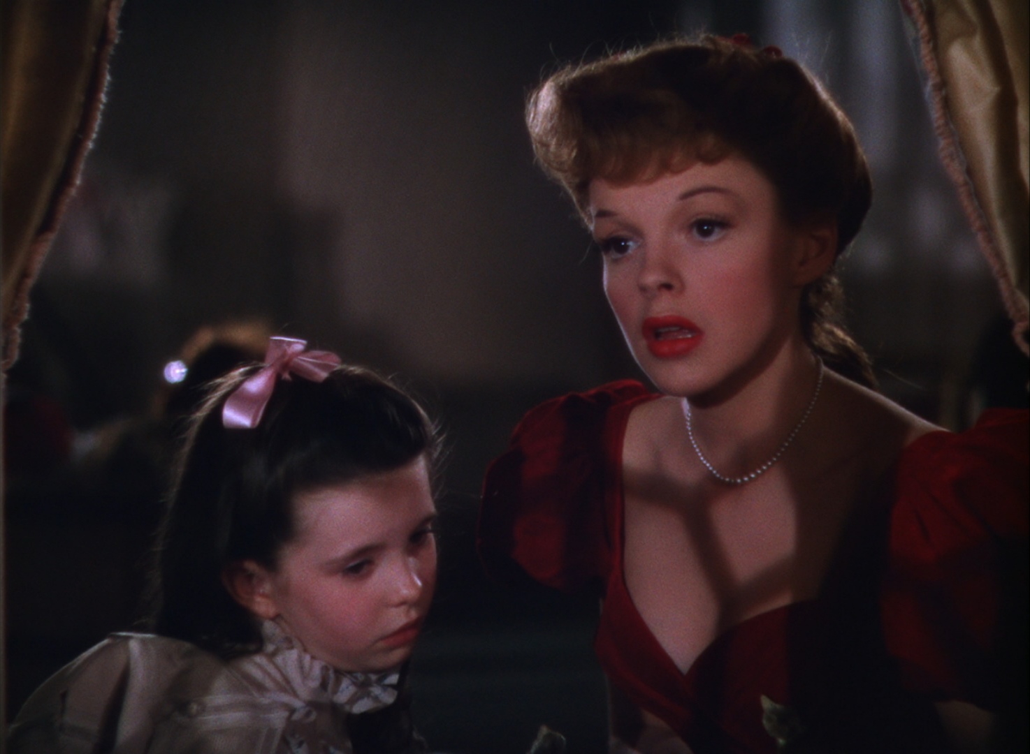 Still from "Meet Me In St. Louis" featuring Judy Garland, singing Have Yourself a Merry Little Christmas